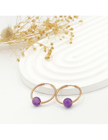 Argollas de amatista en acero para tranquilidad emocional, protección energética y claridad mental.