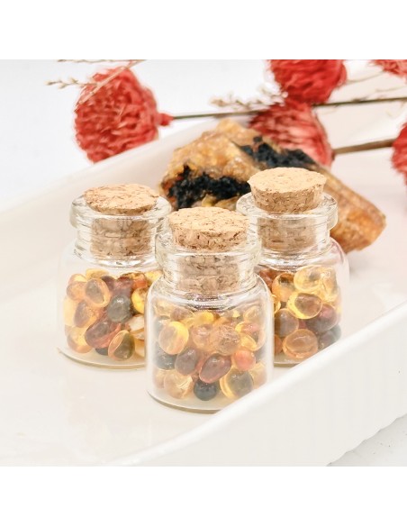 Frasco de âmbar rolado pedras naturais