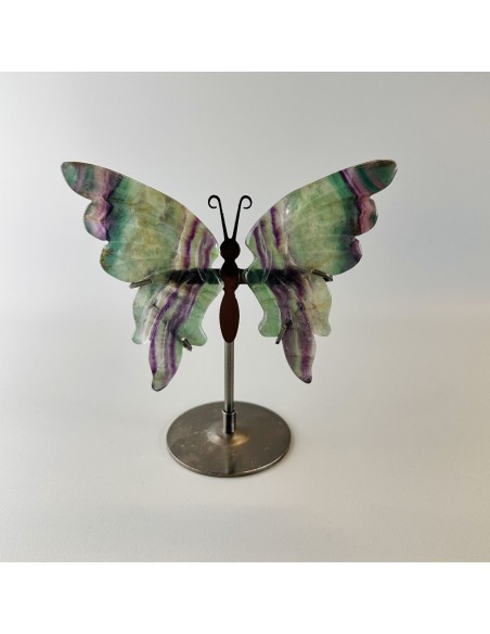 Mariposa de fluorita con soporte que activa claridad mental, armonía espiritual y renovación vibracional