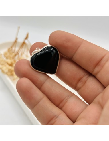 Colgante de ónix en forma de corazón para protección energética, fuerza interior y estabilidad emocional.