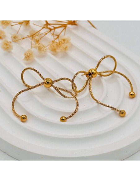 Pendientes lazo Joana en acero inoxidable para armonía femenina, suavidad energética y elegancia consciente.