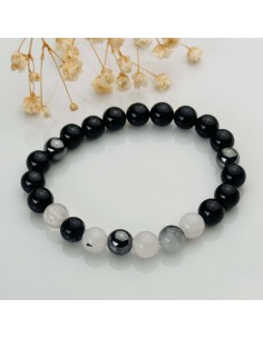 Turmalina negra, cuarzo turmalinado y hematita para protección energética y anclaje profundo.